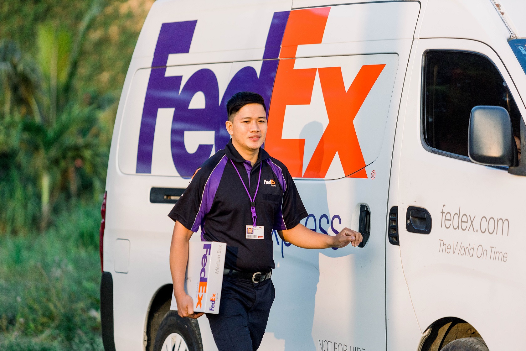 This is an image of a FedEx delivery driver. 