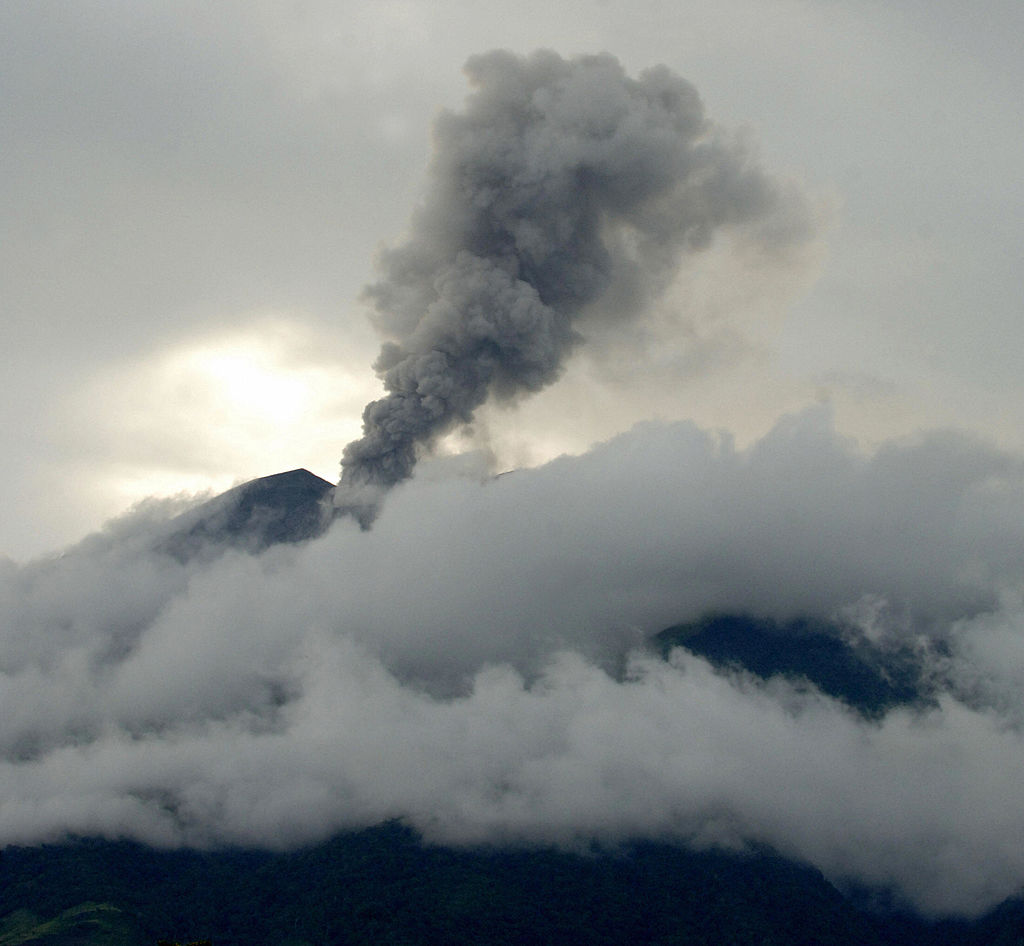 Kanlaon volcano in the central Philippines emits a column of steam and ash into the air.