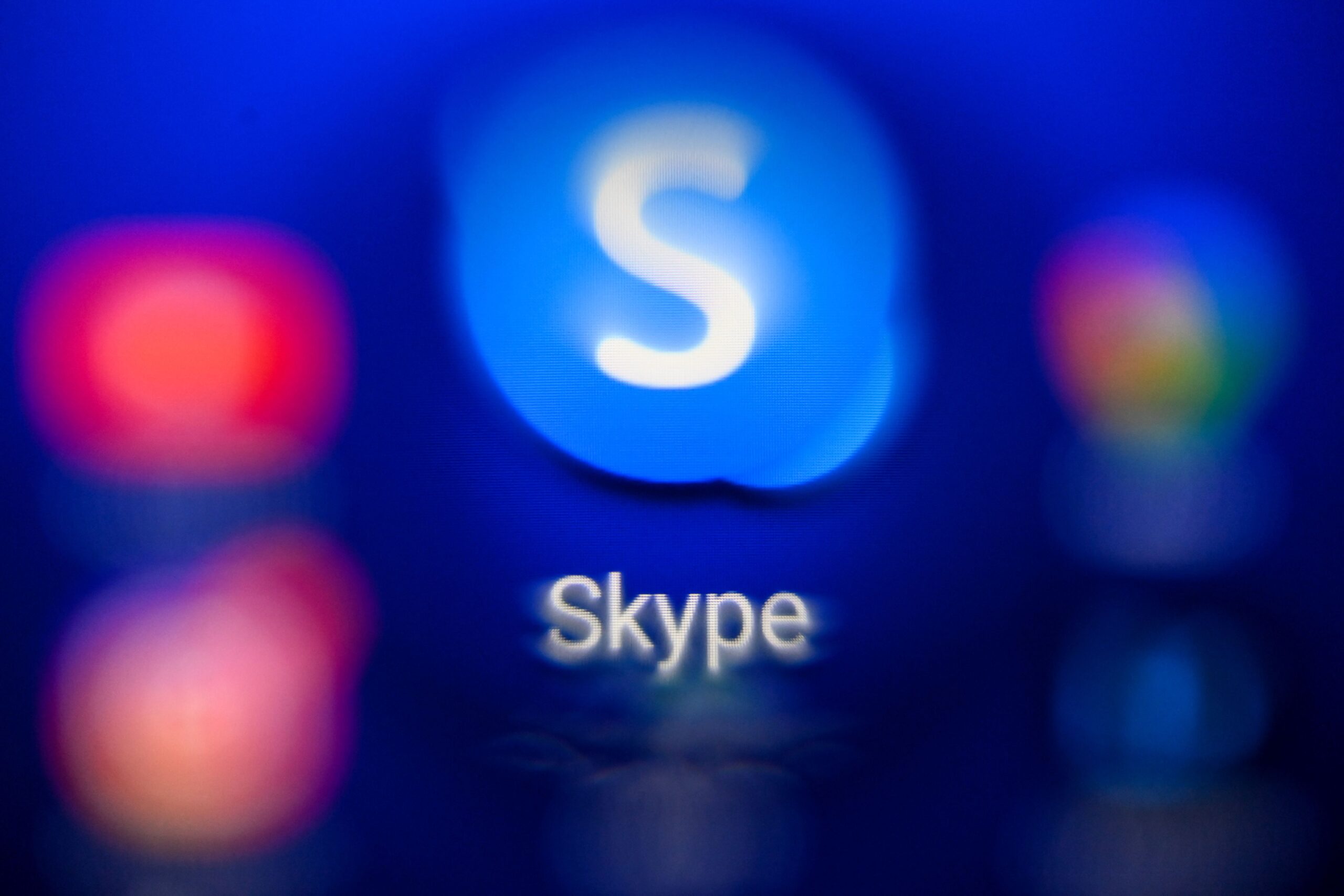 A picture taken on October 18, 2021 in Moscow shows the Internet telephone system Skype's logo on a tablet screen.