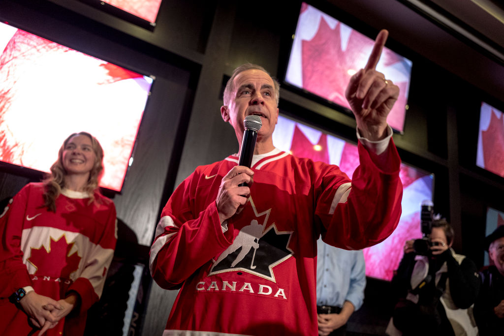 Canada's Liberal Party Leader Candidate Mark Carney speaks to supporters at a watch party for the NHL 4 Nations Face-Off game between the United States and Canada at the Hometown Sports Grill on February 15, 2025 in Ottawa, Canada.