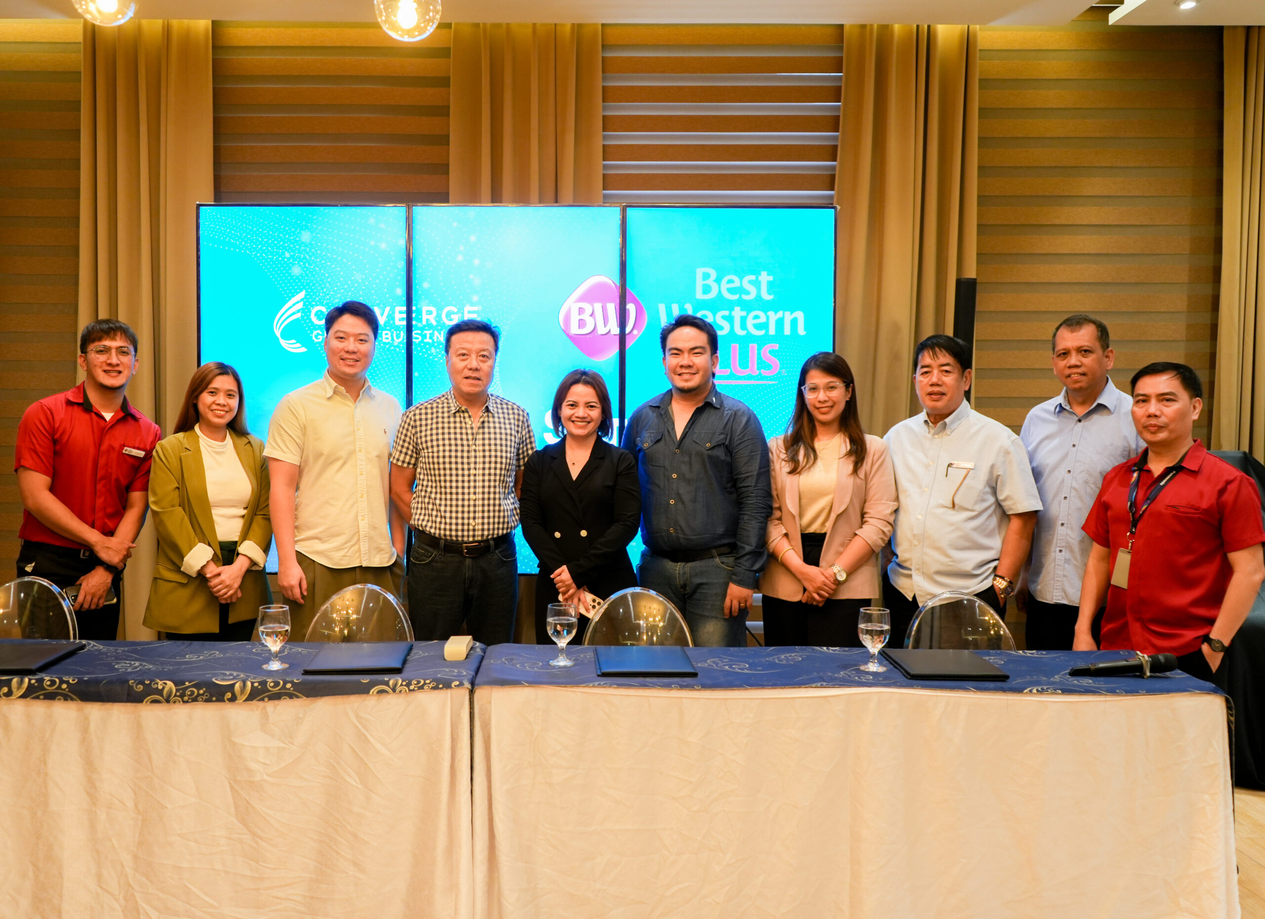 Converge Global Business Sales Acting Sector Head Quennie Joy Lopez (fifth from left) joins Savers Group Holdings Inc. Chairman & CEO Jaime “Jack” Uy (fourth from left) and Executive Vice President Justine Shaun Uy (third from left), together with key members of the Best Western Plus and Converge Global Business IT and Marketing teams.