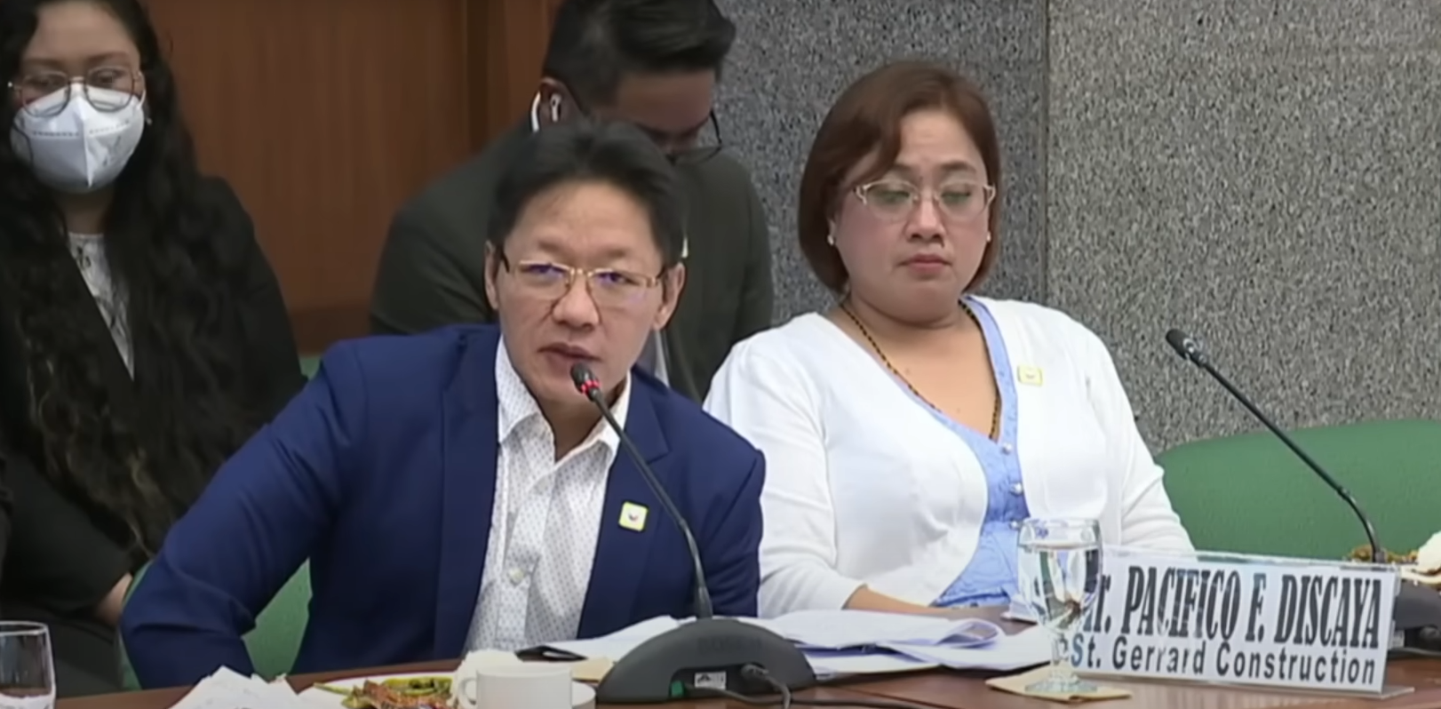 Curlee Discaya answering Tulfo's question - beside him is his wife Sarah Discaya.