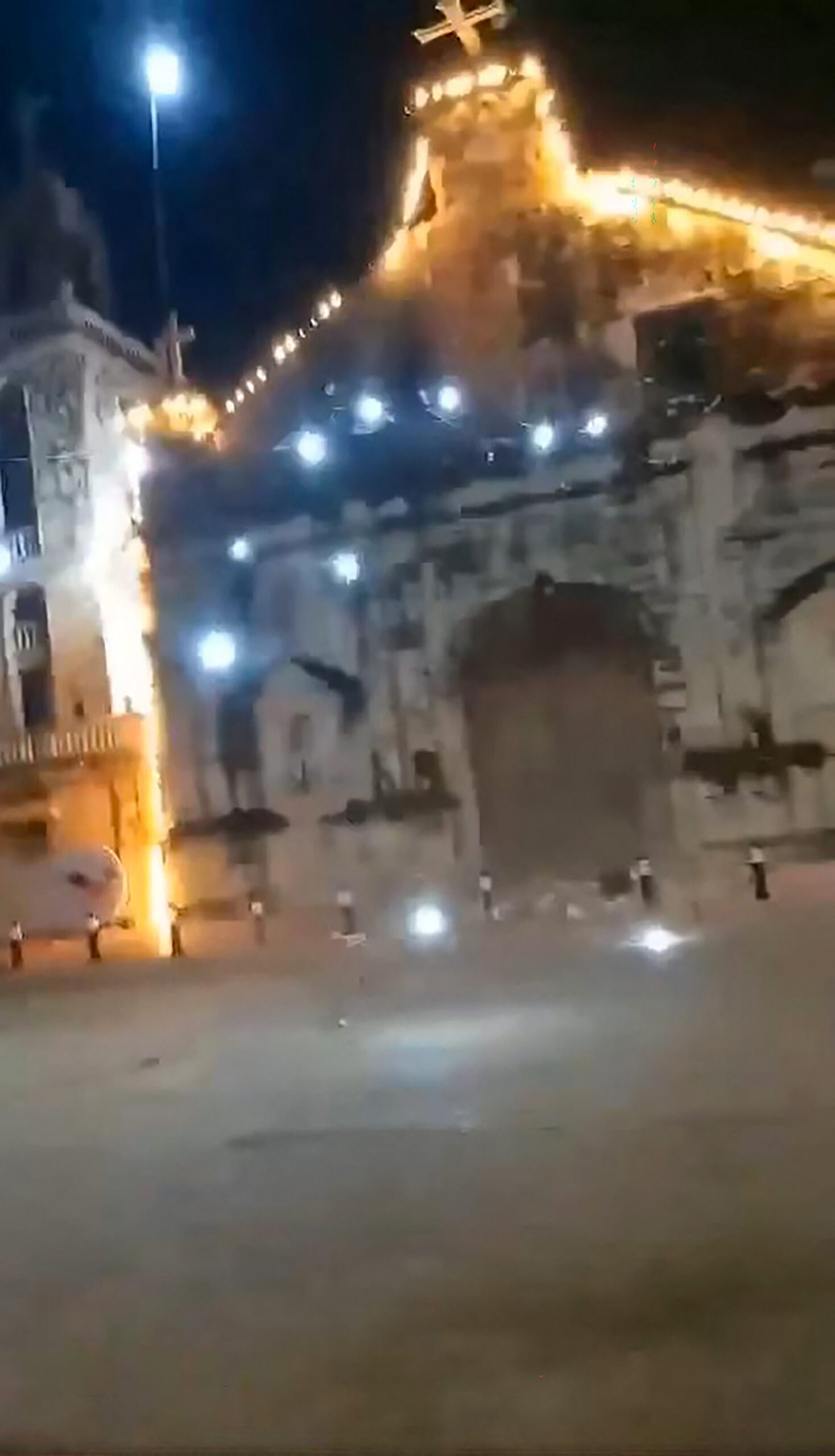 TOPSHOT - This handout screen grab taken from UGC video footage courtesy of Facebook user Martham Pacilan taken and received on September 30, 2025 shows the cross of a church about to fall owing to earthquake vibrations at the Bantayan Island in central Philippines. A 6.9-magnitude quake struck off the coast of central Philippines on September 30 evening, the US Geological Survey said, with no immediate reports of casualties or damage. (Photo by Courtesy of Facebook user Martham Pacilan ,FACEBOOK,UGC / AFP) / XGTY / RESTRICTED TO EDITORIAL USE - MANDATORY CREDIT "AFP PHOTO/Courtesy of Facebook user MARTHAM PACILAN /Handout - NO MARKETING NO ADVERTISING CAMPAIGNS - DISTRIBUTED AS A SERVICE TO CLIENTS - NO ARCHIVE 