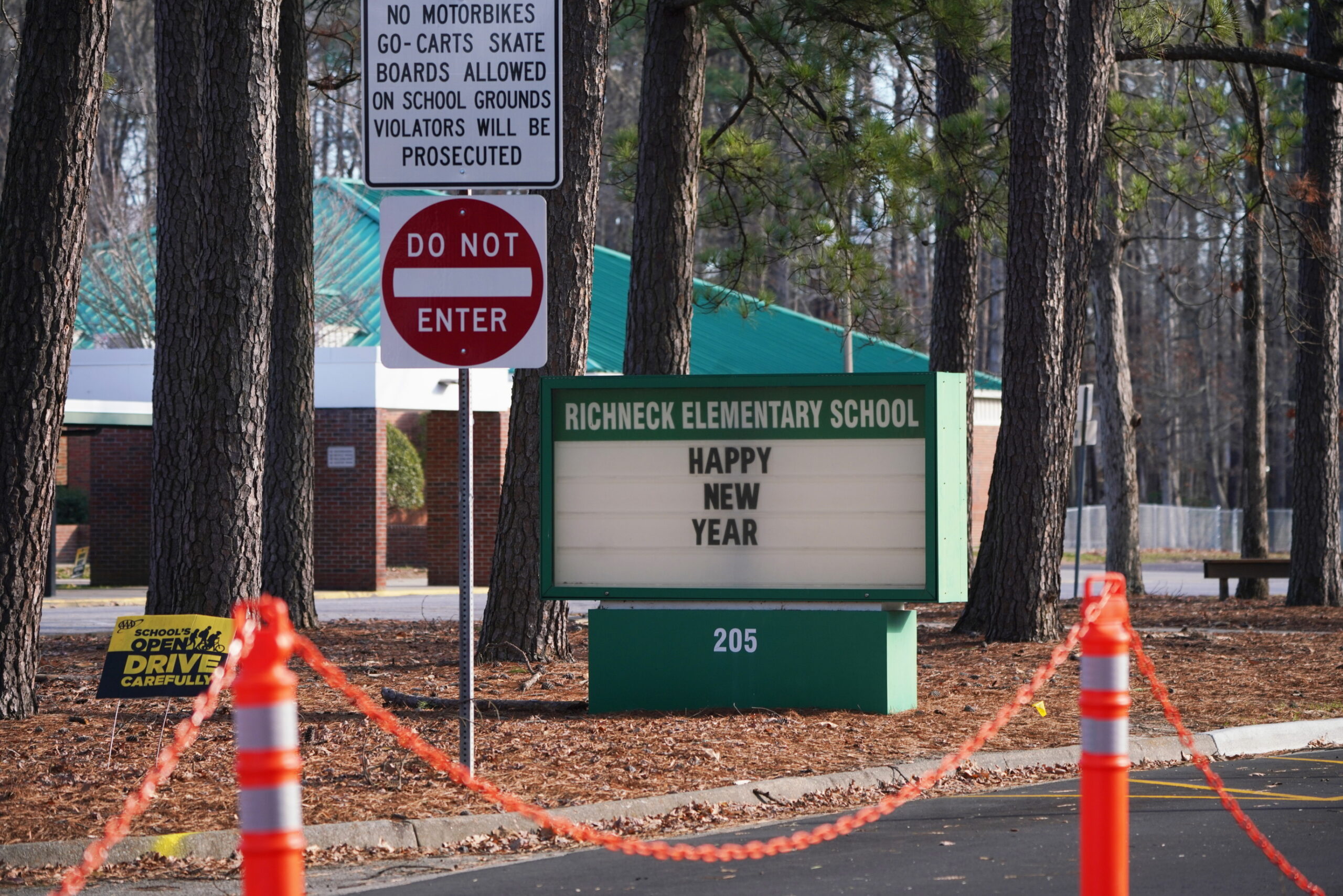 A school sign wishing students a "Happy New Year" is seen outside Richneck Elementary School.
