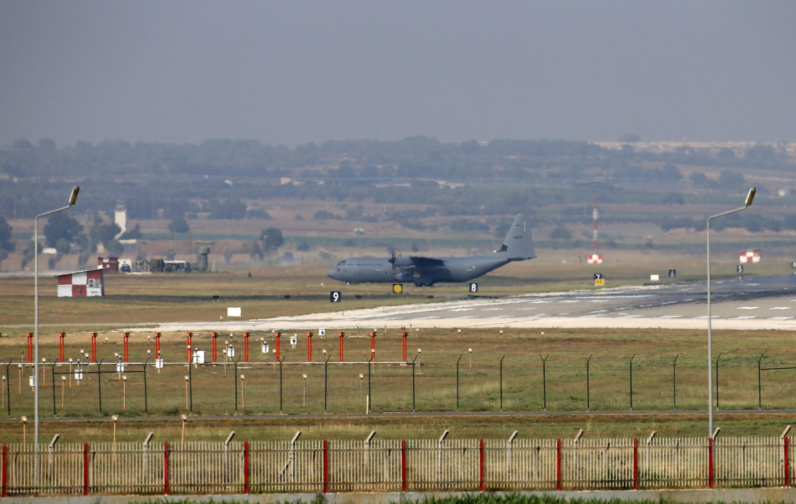 C-130 military aircraft maneuvers on the runway at Incirlik Air Base.